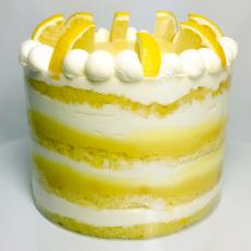 After attending the Culinary Institute of America in California, Nichole Hensen returned to North Dakota, honing her skills at two local businesses before opening a spot of her own in 2003. Using local, organic ingredients but European technique, Hensen turns out spectacular cakes like this citrusy number. Thereâ  s tart lemon flavor in every layer, from the cake to the whipped cream to the bright yellow curd.