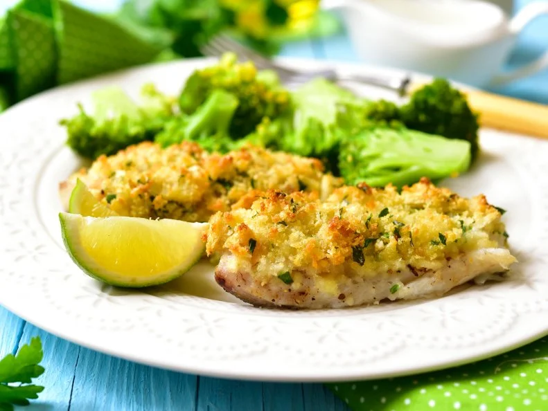 Cod baked with garlic bread crumbs garniched with broccoli.