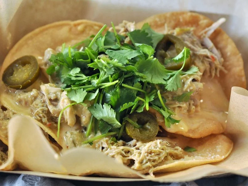 A million miles from salty, orange nachos people expect at stadiums and movie theaters, the these Smoky Chicken Nachos — from Twin Cities Foodies (section 101) — would be winners in any setting. A close cousin to tostadas, they feature moist, smoky chicken, piled high on whole fried corn tortillas, all draped in a luscious cheese sauce. Pickled jalapenos and loads of fresh cilantro finish a dish that might make you ok with missing the half-time show to grab snacks. For those at home, roast chicken for nachos in green chili sauce.