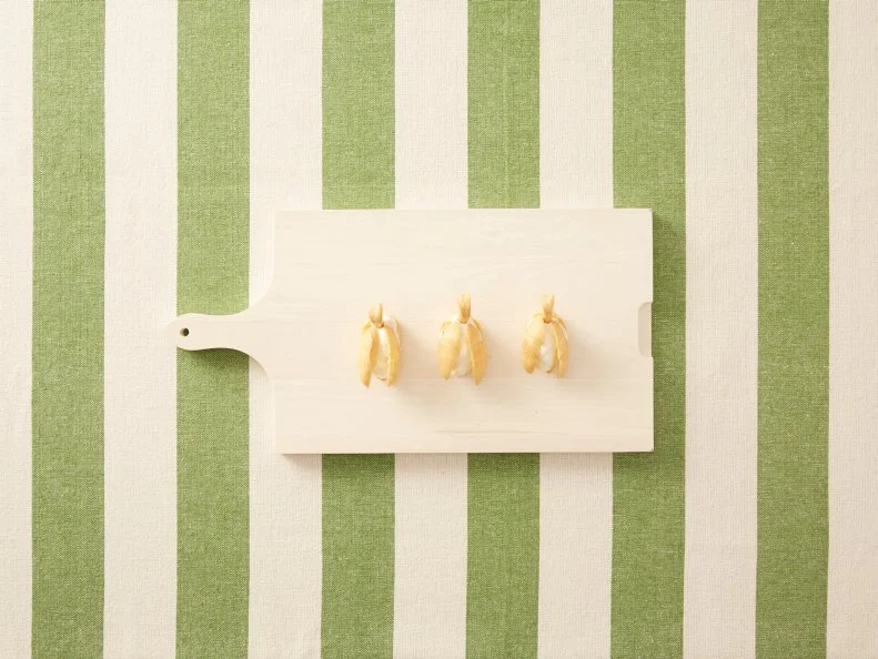 Making Cream Puff Animals - Cream Puff Swan: Piping dough into shapes, then baking, slicing, and filling with pastry cream to create cream puff swans for Eatertainment, as seen on Kids Baking Championship, Season 2.
