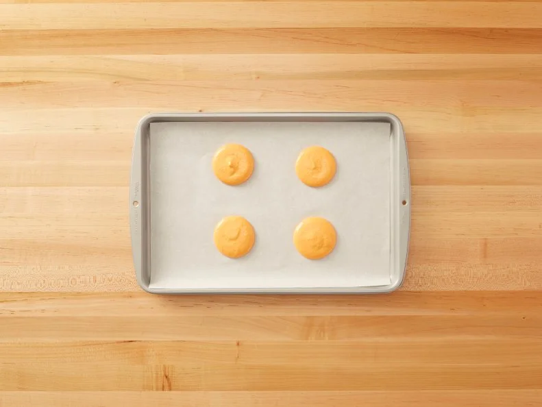 Cutting a Pint of Ice Cream - Macaron Ice Cream Sandwich: Cutting a pint of ice cream into disks and then stacking them in between macarons to create Macaron Ice Cream Sandwiches for Eatertainment, as seen on Kids Baking Championship, Season 2.
