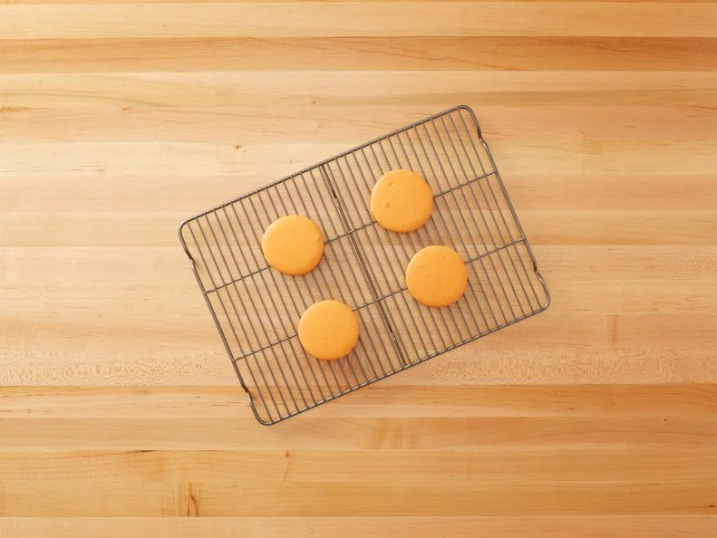 Cutting a Pint of Ice Cream - Macaron Ice Cream Sandwich: Cutting a pint of ice cream into disks and then stacking them in between macarons to create Macaron Ice Cream Sandwiches for Eatertainment, as seen on Kids Baking Championship, Season 2.