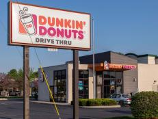 Lancaster, PA, USA - May 8, 2018: Exterior sign of Dunkin' Donut fast food bakery and store, which offers fresh doughnuts, sandwiches, coffee and beverages at over 12,000 locations.