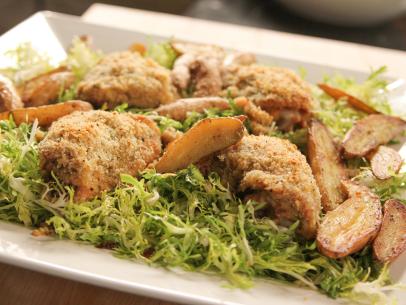 Close-up of Crispy Mustard Chicken and Frisee Salad, as seen on Barefoot Contessa: Back to the Basics, Season 15.