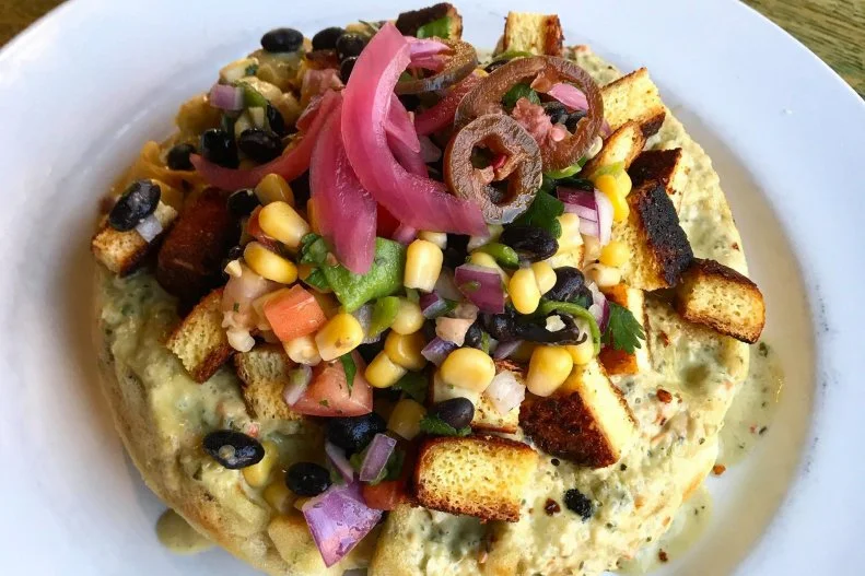 In addition to having you covered whether you need a latte at 7 a.m .or a whiskey at 1:30 a.m., Denver's stylish City, O' City masterfully caters to veggie cravings at any time of day or night. Most notably, the kitchen here works round-the-clock magic with waffles in a wide array of dishes â   teamed with chicken-fried cauliflower, pressed into grilled cheese with green apples and tempeh bacon, soused with coconut sofrito and Hatch chile salsa, or transformed into a Cubano, with smoky jackfruit and seitan ham.