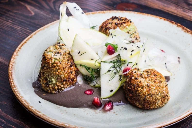 Gastropubs tend to conjure images of thick, juicy burgers, gussied-up chicken wings, and fish and chips, all accompanied by plenty of craft beer. Comfort food — with a refined, global twist — is on the menu at this Miami hot spot, but the difference is that it's entirely plant-based. So raise a glass to jackfruit gyoza, Korean BBQ pulled-tempeh sliders, yam-noodle ramen, and hemp-crusted edamame cakes with black tahini sauce, shaved fennel and celery root.