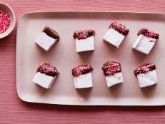 Nothing says "I love you" like these adorable pink marshmallows dipped in chocolate.