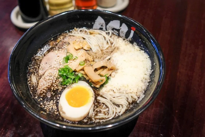 Since launching in 2013 in Honolulu, Agu has quickly expanded to five Oahu locations and is now moving onto the mainland in Texas. Known for its signature broth, which takes 24 hours to create, one of its top specialties is kotteri ramen (kotteri describes the thick and rich consistency of the broth). The addictive kotteri with cheese starts with extra-rich tonkotsu broth made with black garlic oil, garlic chips and succulent pork back fat and is topped with a huge, and airy pile of fine wisps of Parmesan cheese that melts into the soup.