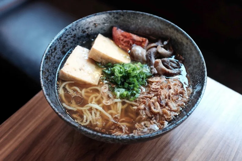 Goro Ramen started life as a pop-up and now packs the house at lunch and dinner. The menu, consisting of Chef Jeff Chanchaleune’s playful snacks and ramen, is a mash-up of Japanese flavors and techniques with Korean, Chinese, Thai and Vietnamese dishes the chef has cooked, eaten and enjoyed. Specialties include vegan yellow curry ramen with coconut and vegan broth, tofu, mustard greens, yellow bell peppers, cilantro and peanuts; and yasai with vegan broth, tofu, roasted tomato, mushrooms, fried shallots and negi.