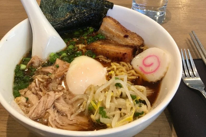 Momofuku CCDC, which opened in 2015, has a constantly evolving menu focusing on seasonal dishes that feature Mid-Atlantic purveyors. Something of a ramen fanatic, Momofuku founder David Chang offered a recipe for ramen in the Momofuku cookbook that includes kombu, dried shiitakes, chicken legs, pork leg, smoky bacon, onions and a carrot. Though ramen is a mainstay of the Momofuku empire, at CCDC it is available only at brunch and lunch. The pork ramen comes with pork shoulder, bean sprouts and a poached egg.