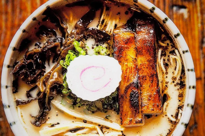 After four years in business, Mu Ramen just underwent a renovation that more than doubled its size. The chef behind the popular Long Island City shop is Joshua Smookler, who has a background in fine dining. Like many ramen chefs, he isnâ  t Japanese. In fact, he was born in Korea and raised in a Jewish family in New York, which perhaps explains his love of both noodle soups and spicy flavors. At this true fusion spot, his latest menu features the signature Mu Ramen with IbÃ©rico pork bone broth, JamÃ³n IbÃ©rico and arugula.