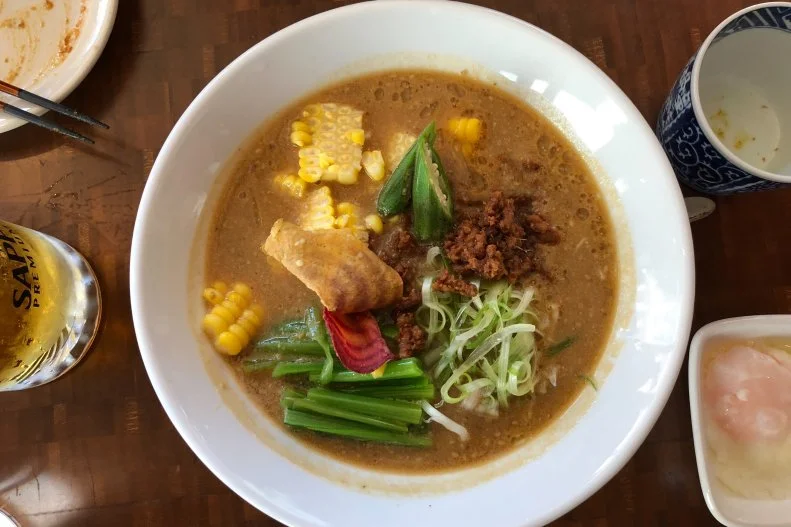 Nojo Ramen Tavern in San Francisco is an offshoot of a ramen company headquartered in Tokyo. In both Japan and the U.S. they focus on chicken-based ramen, rather than the more common pork, offering ramen with chicken meatballs, chicken leg, shredded chicken tenders or ground chicken. But the veggie miso ramen is as satisfying as any of the chicken versions. It features a seasoned ground soybean and brown rice topping that has the taste and texture of ground meat, along with fresh corn, Japanese greens, beet chips, scallion, okra and a combination of garlic oil and butter.