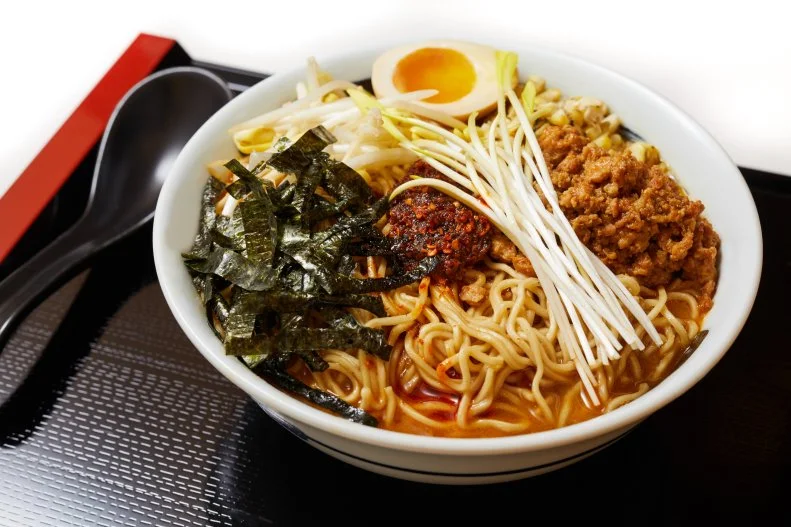 Since opening in 2017 Ruckus in Chinatown has been serving up a variety of modern takes on Japanese noodle dishes, including ramen made with housemade noodles. Chef Mike Stark’s Miso Lit Ramen is made with a spicy miso broth, a soy egg, ground pork, grilled corn, shaved nori, bean sprouts and Ruckus paste, a housemade chili paste. Optional additions to take your ramen up a notch include smoked marrow butter, pig tail XO sauce or the Umami Bomb — whipped pork butter. The cool space features bold Murakami prints and Star Wars samurai figurines.