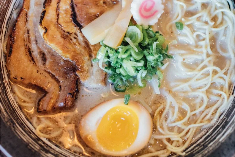 Youâ  ll find a taste of Japan in Las Vegas with each slurp of the Shinya Way to Heavenramen, Shinya Maruâ  s version of the classic tonkotsu. The bowl starts with a light, creamy broth that's simmered for 15 hours. The thick-cut chasu is roastedand torched to give it a crisp char, and bamboo shoots and bean sproutsprovide additional crunch and a touch of freshness. A drizzle of smoky black garlic oil amplifies the soup's rich flavor and adds depth. The bowl is topped with green onions, soft-boiled egg and a naruto fish cake.