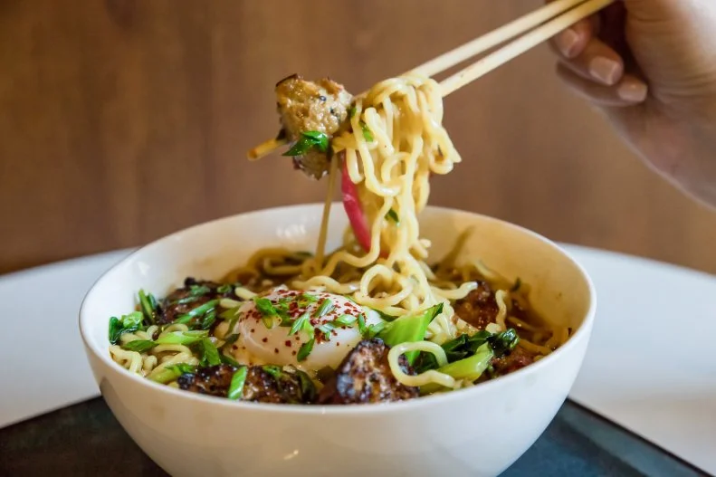 The Corner Office is a Denver martini bar and restaurant serving global takes on comfort food, which always include a version of ramen. Executive Chef Rich Byers masterfully composes veggie ramen with portobello mushrooms, miso broth, a 63-degree egg, chili sambal and seasonal vegetables such as broccolini or snap peas and arugula. This downtown restaurant is attached to The Curtis Hotel and is across the street from the Denver Center for the Performing Arts, making it a convenient spot to stop in before or after a show.