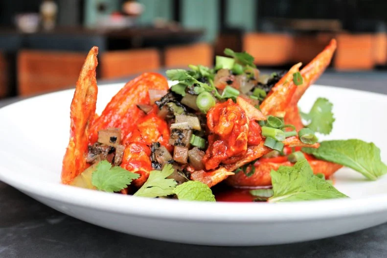 Happy hour is wing time at this Austin haunt, complete with live music and local fare. The chicken wings are the perfect mix of sweet, spicy and pungent — cooled down by the pickled watermelon rind served on the side.
