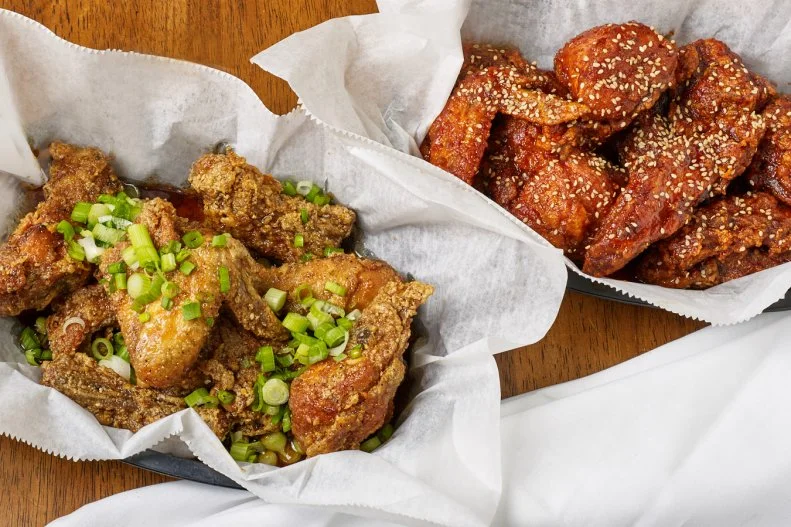 Tucked away in Chicago's Lakeview neighborhood is Crisp, an unassuming restaurant serving up stellar Korean-style fried chicken and wings. Although all of the sauce choices are worth a gander, neighbors flock here for the Seoul Sassy wings, a recipe that has been passed down over generations. The sauce is a sweet, sticky mess — in the best way — with flavors of ginger, soy and garlic.