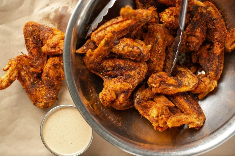 Pat Martin may be known for his whole-hog cooking, but anything he cooks in the pit is pure West Tennessee BBQ magic. The wings are no exception. You can opt for any of six sauces, but a favorite is made naked with Martin's dry Dixie rub sprinkled on moist and juicy chicken wings — with perhaps a little Alabama White sauce on the side.