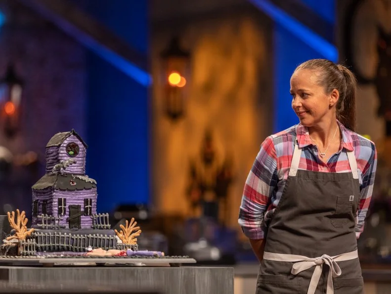 Contestant Lyndsy McDonald presents her dish from the main heat to the judges, as seen on Food  Network's Halloween Baking Championship, Season 4.