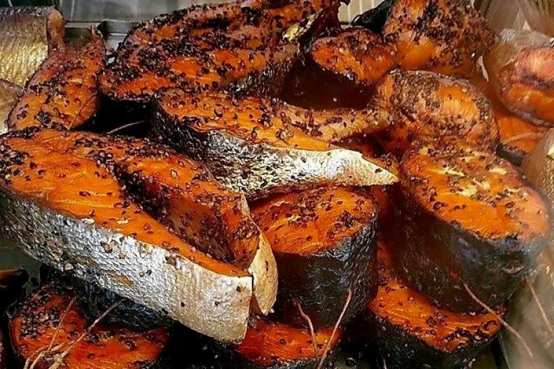 Second-generation owner Mark Kotlick carries on the work of his dad and uncle by slow-cooking the luscious, ruby-hued, black pepper-scented Alaskan salmon that helped this icon win a James Beard Award. The famed eatery has fed celebrities ranging from John Belushi and Dan Aykroyd (a Blues Brothers scene was filmed right out front) to Anthony Bourdain. Calumet Fisheries, which opened in 1928 and was purchased by the Kotlick family in 1948, is one of the last businesses in the city of Chicago that are allowed to use wood to smoke their products. Their trout, whitefish and eel, plus a wide selection of other seafood delicacies, come out of blackened smokehouses charred by almost a century's worth of fire.