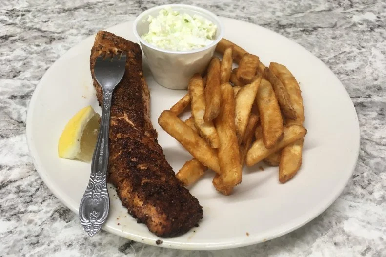 When husband and wife Frank and Helen Magee saw 25-year-old Rocky Mountain Seafood was for sale in Afton, they decided to pack up their lives in Nevada to move home to Wyoming. The couple now own their home state's premier seafood place. Multiple times per week they get orders of fresh fish flown into nearby Salt Lake City and trucked up to their small town, home of the "World's Largest Elkhorn Arch." The restaurant has received rave reviews from seafood lovers from all over the region for its blackened Canadian salmon, Alaskan halibut fish and chips, and Cod Parmesan. While the list of options is short, there's no need to worry if there are "fish haters" in your party: Rocky Mountain offers a special menu just for them, with rib-eye steak and a couple of other non-seafood dishes.