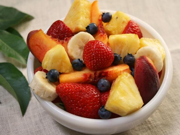 A bowl of a mixture of fruit.