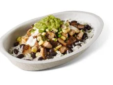 We were relatively surprised to discover that it's not the Burrito but rather its lower-carb alternative, the Burrito Bowl, that tops the popularity chart at Chipotle. Specifically, it's the Chicken Burrito Bowl â   a flavor festival of rice, beans, fajita veggies and other essentials, such as salsa and sour cream (and guac, if you're willing to cough up the extra $1.95), united around a foundation of smoky, spicy adobo grilled chicken that's deliciously charred for subtle caramel flavor.