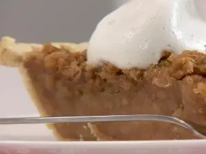 No Apple Apple Pie with a No Cream Whipped Cream prepared by Chef Jamika Pessoa.  Food and Lifestyle Expert, Brandi Milloy turns pan to Medium- Low heat.  She then begins to add 2 cups of water, 1/2 cup of brown sugar, 1/2 cup of granulated sugar, cinamon and nutmeg.  Food and Lifestyle Expert, Brandi Milloy, adds cream of tarter for a fruity flavor.  While the mixture is boiling, add 3/4 tablespoons of butter, add lemon juice, zest a lemon and stir.  Lastly, add vanilla extract.  Pour the syrup on top of 30 - 40 buttered crackers.  In a seperate bowl, crush crackers up, add a 1/4 cup of brown sugar, melted butter and cinammon.  Chef Stuart O'keeffe passes Chef Jamika a pie shell to pour the crackers soaked in syrup.  Add the crushed cracker topping on the pie.  Place the pie in the oven for 10 minutes at 400 degrees, then turn the oven down to 350 degrees and ake for 18 - 20 minutes.  For the No Cream Whipped Cream, Chef Jamika uses a mixer.  Pour the liquid from a can od Chick Peas and start the mixer on low and gradually increase speed.   Add cream of tarter and increase the speed.  Add powdered sugar for sweetness and crank the speed all the way up until it begins looking fluffy.  Add vanilla extract last and turn it off.  Grab your pie from the oven and layer with your "whipped cream" and Bon Appetit!, as seen on Let's Eat!, Season 1.  
