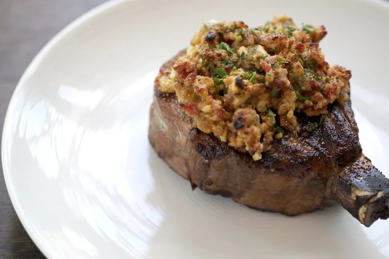 This Kansas City steakhouse has earned accolades like being named one of the Best Steakhouses in America by Thrillist, so you can trust the chefs at the grill. They offer both wet- and dry-aged beef, a rarity even among the most-high-end chophouses, but another thing that sets them apart is their customization. Order any steak and ask them to “Stock It” and you'll receive that filet topped with blue cheese, a walnut blend (including some maple syrup) and house bacon seasoned with 10 different spices.