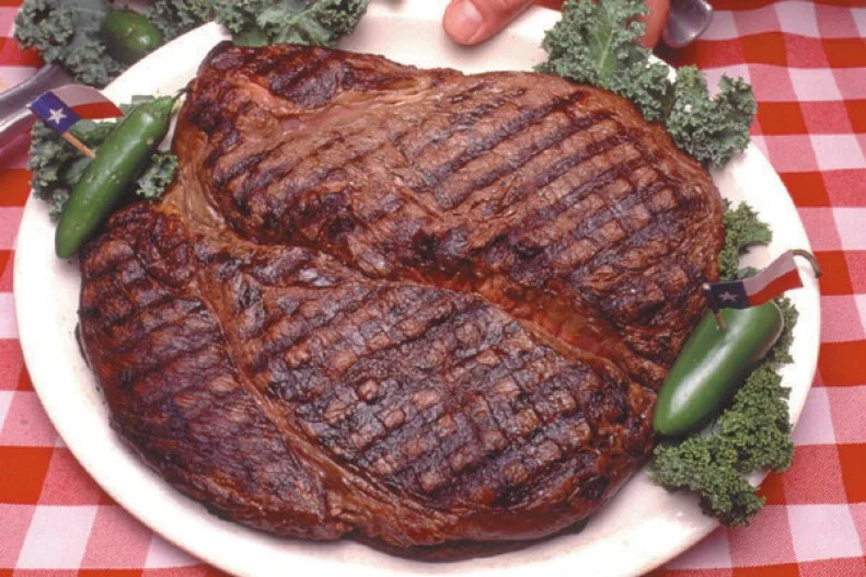 They say everything's bigger in Texas, and of course that also applies to the steaks. Back when The Big Texan opened in 1960, beer was a quarter and on Fridays a $5 fee earned cowboys an all-you-can-eat feast â   whoever finished the most meat won back his money. The tradition continues today, but with a few more rules (and a higher entry fee of $72). The meal must be completed in one hour, you're not allowed to stand up, and no one's allowed to help. Entering the hall of fame is naturally the goal, but if you don't finish all 72 ounces there's still a nice consolation: You can bring home the leftovers.