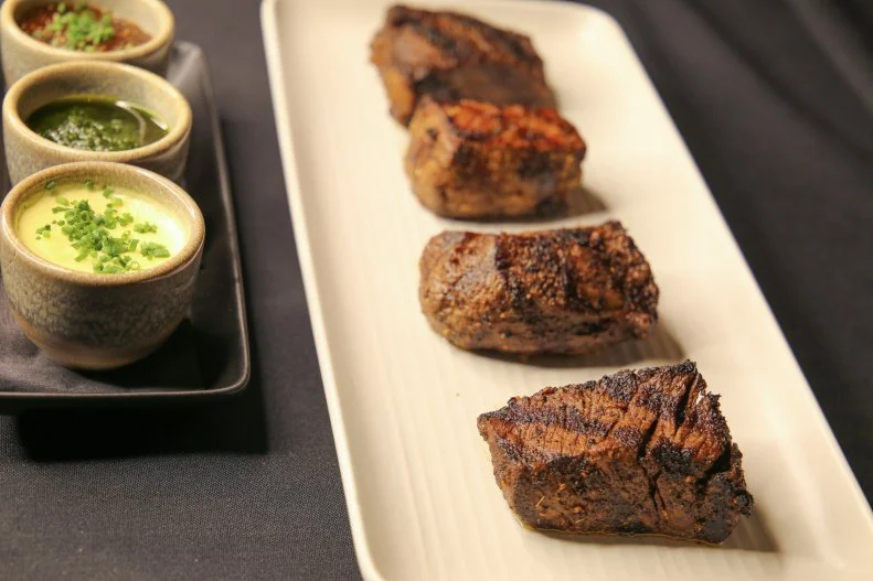 The proprietors of acclaimed steakhouse The Butcher's Table want you to try their Japanese beef — so much so that they offer their Mishima Reserve full-blooded Japanese Black wagyu in tasting flights. For those looking to try different fat grades, the Manhattan-cut New York and filet mignon offer four-ounce portions of 4-star, 5-star and Ultra quality. The other option is to explore different cuts of the cow, with four pieces of 5-star beef, including the eye of rib, New York strip, cap of rib eye, and filet mignon.