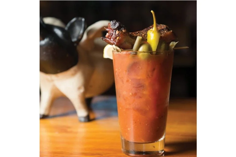 Dry-rubbed, hardwood-infused meat finds its way into most everything at this duo of Maine-based BBQ joints. And that very much extends to the drinks menu, where margaritas, dark and stormys and, yes, piquant Bloody Marys come opulently accessorized with slow-smoked baby back ribs.