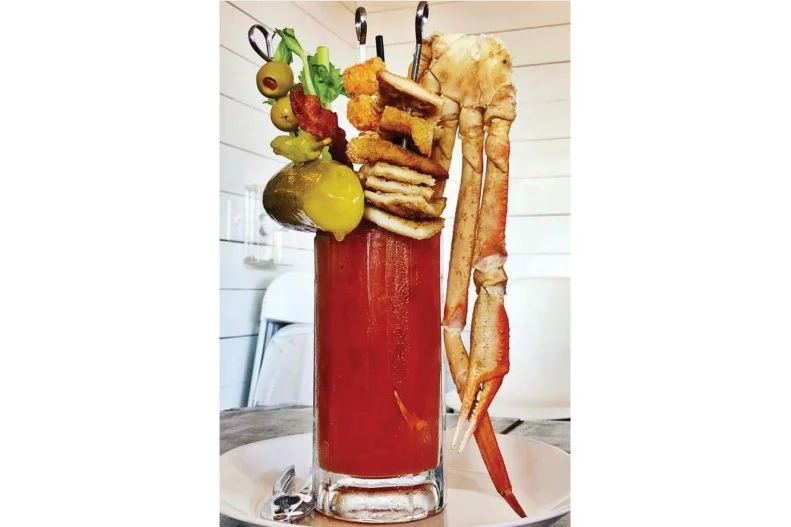 Nashville strikes again, thanks to Flipside, which makes a play for Party Fowl's Bloody Mary crown with The Big Fix. A dill pickle and bacon share real estate in a frosted mug with a skewer brandishing fried chicken cutlet wedges and Tater Tots, and a massive snow-crab claw draped dramatically over the side.