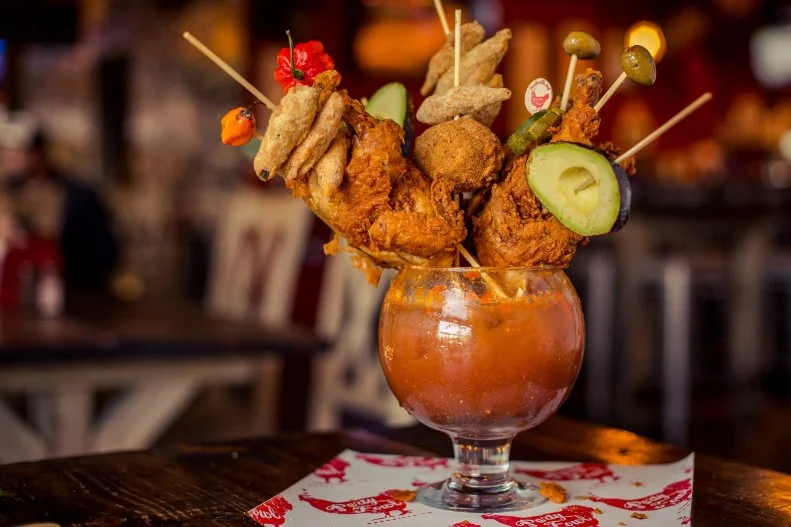 This Nashville funhouse certainly isn't guilty of false advertising when it comes to its infamous Brunch for Two. There's no reason to bother with anything else on the menu, considering this goblet-proportioned offering provides patrons with more calories than they can possibly need in a day, presented on sticks precariously stacked with fried okra, a halved avocado, Scotch eggs, olives and two split hot Cornish game hens.