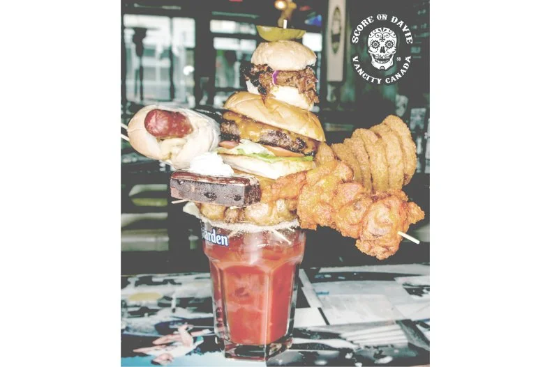 Oh, Canada! You may want to consider taking a day trip across the border for brunch, in pursuit of this totally off-the-wall Bloody. Boozy tomato juice is merely the base (and practically beside the point) in this eminently edible cocktail that's chock-full of roasted chicken and chicken wings, a Sriracha-glazed pulled pork slider, a hot dog topped with pulled pork mac and cheese, a full-size burger, a batch of onion rings and, oh, a brownie for dessert.