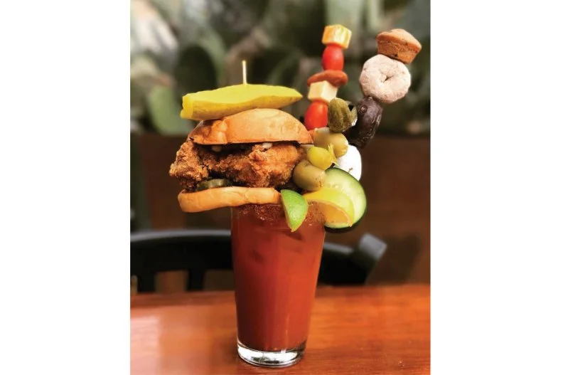 Taking the "everything's bigger in Texas" motto to heart, Star Bar proudly proffers this veritable kitchen sink of a drink â   if you can even call it that. You'll need to plow your way through a cheeseburger, chicken nuggets, li'l cheddar smokies, cubes of cheddar and pepper Jack cheeses, hard-boiled eggs, pickled okra, dill pickles and gherkins, cherry tomatoes and celery, as well as powdered mini doughnuts and a full-sized honey bun, before you get to anything that can be consumed with a straw.