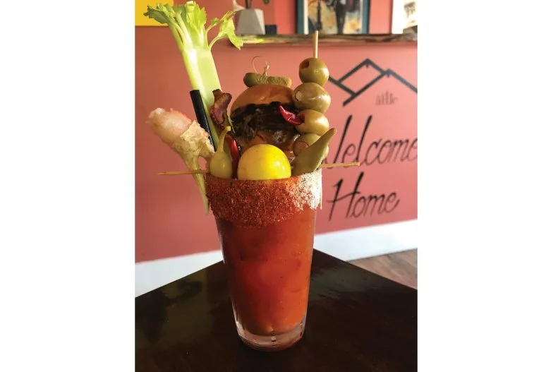 You may not expect to find something so unapologetically meat-centric in sunny SoCal, yet The Attic is wholly unconcerned with beach-physique maintenance â   at least when it comes to their Bloody Mary. It's enriched with a triad of indulgent proteins: a short-rib slider perched on a house-baked bun, a rasher of thick-cut fried bacon and a Slim Jim-stuffed olive.