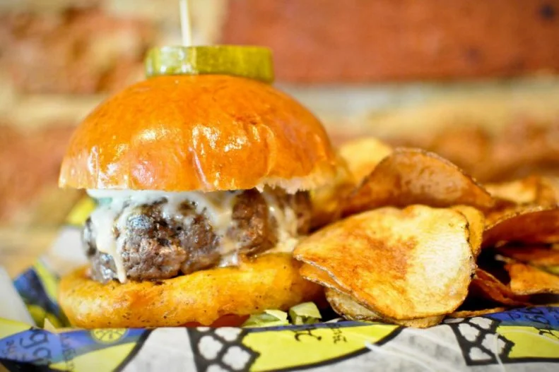 This laid-back bar and grill in hip Federal Hill attracts burger lovers from near and far with its creative combinations of patties and condiments. There's a Greek-inspired lamb burger accented with briny feta and herbed yogurt, a Baltimore Burger with homemade crab dip, and a spicy Korean duck burger. But serious burger lovers opt for the build-a-burger checklist that lets guests pick from a wide range of meat options such as bison and shrimp, customizable rolls ranging from pitas to lettuce wraps and nearly 60 different cheeses, sauces and toppings as varied as pimento cheese, habanero pickles, smoked Gouda, and peach and herb salad.