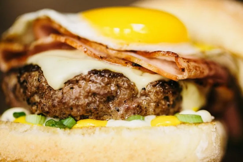 Drive around Nebraska and you're sure to see a lot of cows. So, it's certainly not hard to find a good burger no matter where you are in the state, from griddled patties at roadside dives to fancy-pants city burgers made with prime beef. Block 16 in Omaha is a destination-worthy spot for its elevated interpretations of casual dishes, which include Alton Brown's favorite burger in the country, the Croque GarÃ§on. The one-third-pound burger nestled in ciabatta has what Brown says is the perfect meat-to-bun ratio, and it comes topped with bold, artistic ingredients including cheese, ham, a sunny-side-up egg, mustard and truffle mayo.