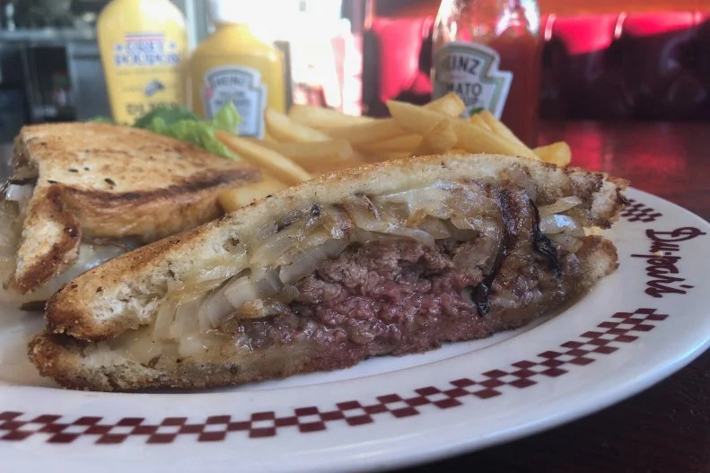 Part burger, part grilled cheese, the patty melt is one of America's original hybrid dishes. It was invented in 1932 by Los Angeles restaurateur Tiny Naylor, and it's been on the menu at Du-par's Restaurant & Bakery at the Farmers Market since 1938. Owned by Tiny's son Biff since 2007, the historic 24/7 diner offers a patty melt true to Tiny's original specifications, with a coarse-ground Harris Ranch chuck patty covered with sweet caramelized onions and melted Swiss cheese on grilled rye bread. It's so buttery and juicy that the poor bottom slice can barely keep itself together.