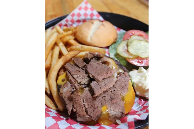 This South Dakota restaurant and bar has a lot of firsts under its belt. It's set in the 1915 building that was formerly home to Rapid City's original firehouse, and it's the state's inaugural brewpub. The local hangout draws the crowds for its house beers and regular live music, but it's also well known for its barbecue, slathered with unique homemade sauces â   as well as its burgers. The brisket cheddar burger highlights all of the kitchen's specialties in one hand-held dish, made from locally sourced buffalo topped with house-smoked brisket, cheddar cheese and a choice of barbecue sauce like the Beer-BQ, made with Firehouse's signature stout.