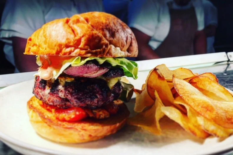 With a vibrant town square lined with locally owned restaurants and boutiques, Paso Robles is like an Americana throwback to the June Cleaver days. But this local hangout hits all the modern trends. Fueled by wood fire, small-batch whiskey and updated riffs on comfort-food classics, it's all about reinvigorating the status quo. The Hatch Burger is the perfect example: a house-blend burger patty, lightly scented with smoke from the wood-fire grill, topped with house-cured and -smoked bacon, white cheddar, oven-dried tomato, Bibb lettuce and Hatch sauce in a Back Porch Bakery brioche bun. Mouth-puckering housemade sea salt-and-vinegar potato chips come on the side.