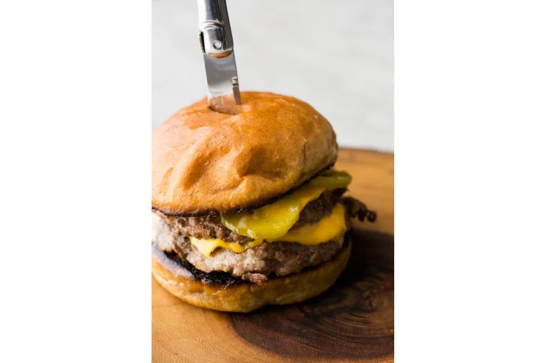 Located on Chattanooga's thriving South Side, Main Street Meats has been steadily growing since Erik and Amanda Niel took it over in 2014. They work with local farmers who are deeply committed to both the environment and the animals under their care, attracting a wide range of customers who want butchers who are concerned about more than the bottom line. Many of those regulars will pick up a steak to take home and a local beef burger to nosh on while at the shop. The burger â   a simple combination of house-ground beef, house pickles, mustard, mayonnaise, caramelized onions, bacon and GruyÃ¨re â   is totally rich without the fancy restaurant airs.