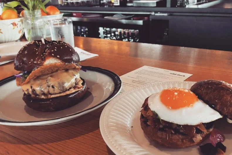 There's no telling what burger will be on the menu at this upscale New American eatery, but the one thing that's certain is that it's going to be very, very good. Consistently hailed as Austin's best burger, Odd Duck's patties have included different proteins (mostly beef, sometimes lamb) and toppings ranging from Japanese mayonnaise to bacon pimento cheese made from local goat cheese. One version was almost like a burger taco with tostada and refried bean mayo. The summer 2018 rendition combined beer cheese, pig face jam, a pickled fried onion ring, arugula and aioli atop a post oak-grilled beef patty. It was served on a Parker House roll made by sister concept Sour Duck Market, with the same yeast starter that's used to make all of its delicious breads.