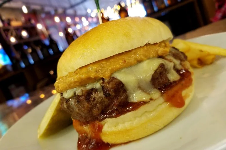 Tucked inside a nondescript strip mall just a short drive from the shores of Rehoboth Beach, this small gastropub serves very distinctive takes on bar food classics. A prime example: its PB&J Burger. Like a sophisticated, meaty version of the snacktime favorite, this 8-ounce Angus beef patty comes with aged cheddar cheese, bacon peanut butter and strawberry-jalapeno jam on a toasted kaiser roll. It's become a local adult mainstay, often washed down with one (or more) of 14 rotating craft beers on tap or special brews from the reserve-bottle list.
