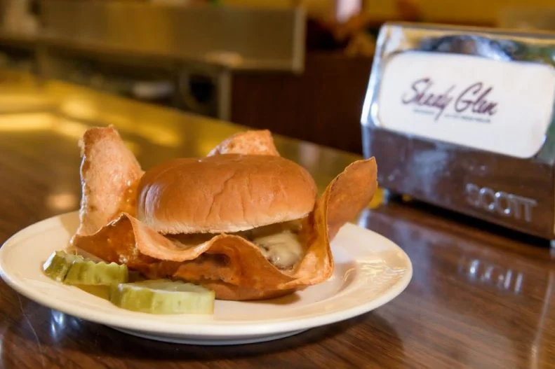 At their core, most burgers tend to be much the same: beef, bun, maybe cheese. But the Bernice Original truly lives up to the "original" in its name. Its American cheese "wings" can be spotted from across a room. The folks at Shady Glen place four slices of cheese onto each burger patty, pulling them past the edge of the burger so the cheese fries directly on the griddle. While it's cooking, the grill master deftly pulls it up into the shape of a crown. The whole thing is then placed on a bun, its golden wings flying in the air. Making this elaborate thing seems easy compared with attempting to fit it inside your mouth.