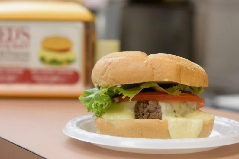 The steamed cheeseburger is a Central Connecticut staple. And it's been on the menu at this family-owned lunch counter since 1959. Each 4-ounce patty is hand-packed and cooked using a custom-built steam cabinet, resulting in a large, pillowy round of beef that gets topped with a 2-ounce block of cheddar that also took a trip through the steamer. That molten cheese is poured over each burger, encasing the patty in a blanket of dairy. Every steamed cheeseburger comes with a side of crispy home fries that swim in another river of that omnipresent gooey cheddar.