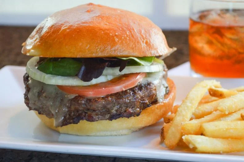 Kansas has deep burger roots. Cattle have long roamed the prairie, and cult-favorite chain White Castle was started in Wichita in 1921. There are so many good burgers in the state that it's hard to choose just one as the best, but The Burger Stand always comes in at the top of the class. The Classic is exemplary, accessorized with just melted Vermont cheddar and served on a substantial white bun. For those looking for something a bit more diverse, there are bold toppings like blue cheese and fresh avocado and housemade sauces like Granny Smith apple chutney and habanero-cactus jam. And while those burgers are great, you'd be foolish to overlook the zesty seasoned fries.