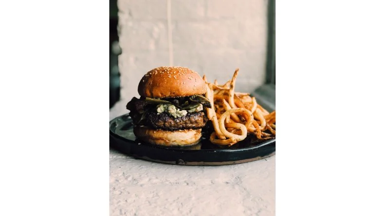 Louisiana chefs (and Cajun Aces stars) Cody and Samantha "Sam" Carroll are known for showcasing at their award-winning New Orleans restaurant Sac-A-Lait the farming, fishing and hunting culture in which they grew up. While their Wild Burger resembles your average upscale bun and patty, it's far more distinctive and far more representative of rural Louisiana than other wild-game rounds. The venison-and-brisket patty is accented with salty wild-boar bacon and contrasted with savory Southern greens and Creole aioli. It's paired with a side of hand-cut fries.