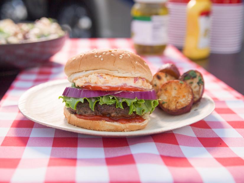 A delicious All-American Backyard Burger topped with Smoked Gouda Pimiento Cheese as seen on Martina’s Table.